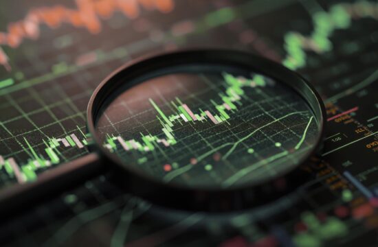 Magnifier glass over financial data chart illuminated by blue, pink neon light. Analyzing stock market with diagrams, search engine optimization SEO, data analytics,